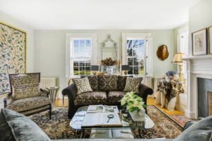 Sage green walls and white wood features in living room